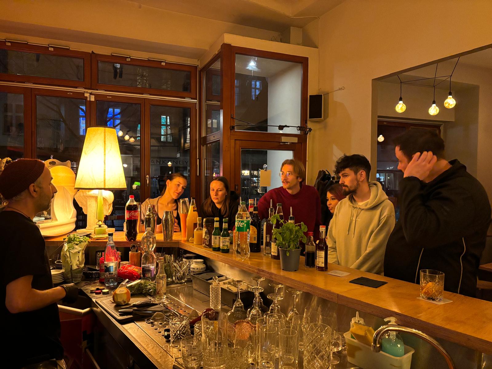 Guests at a Berlin bar at night